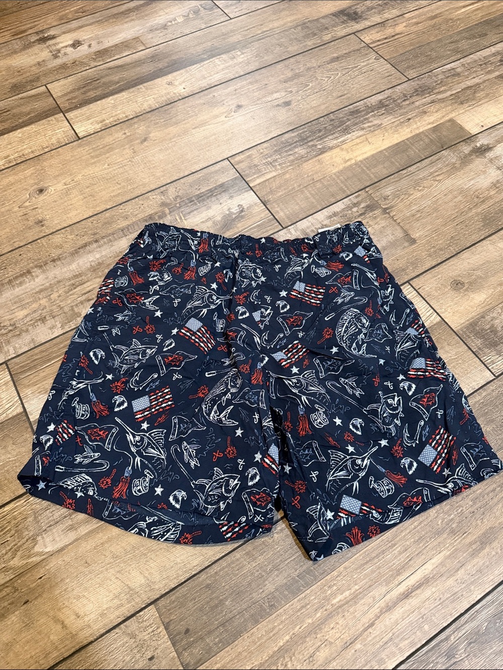 Columbia Navy Swim Trunks with Red & White Patriotic  Print.  Men’s size Small